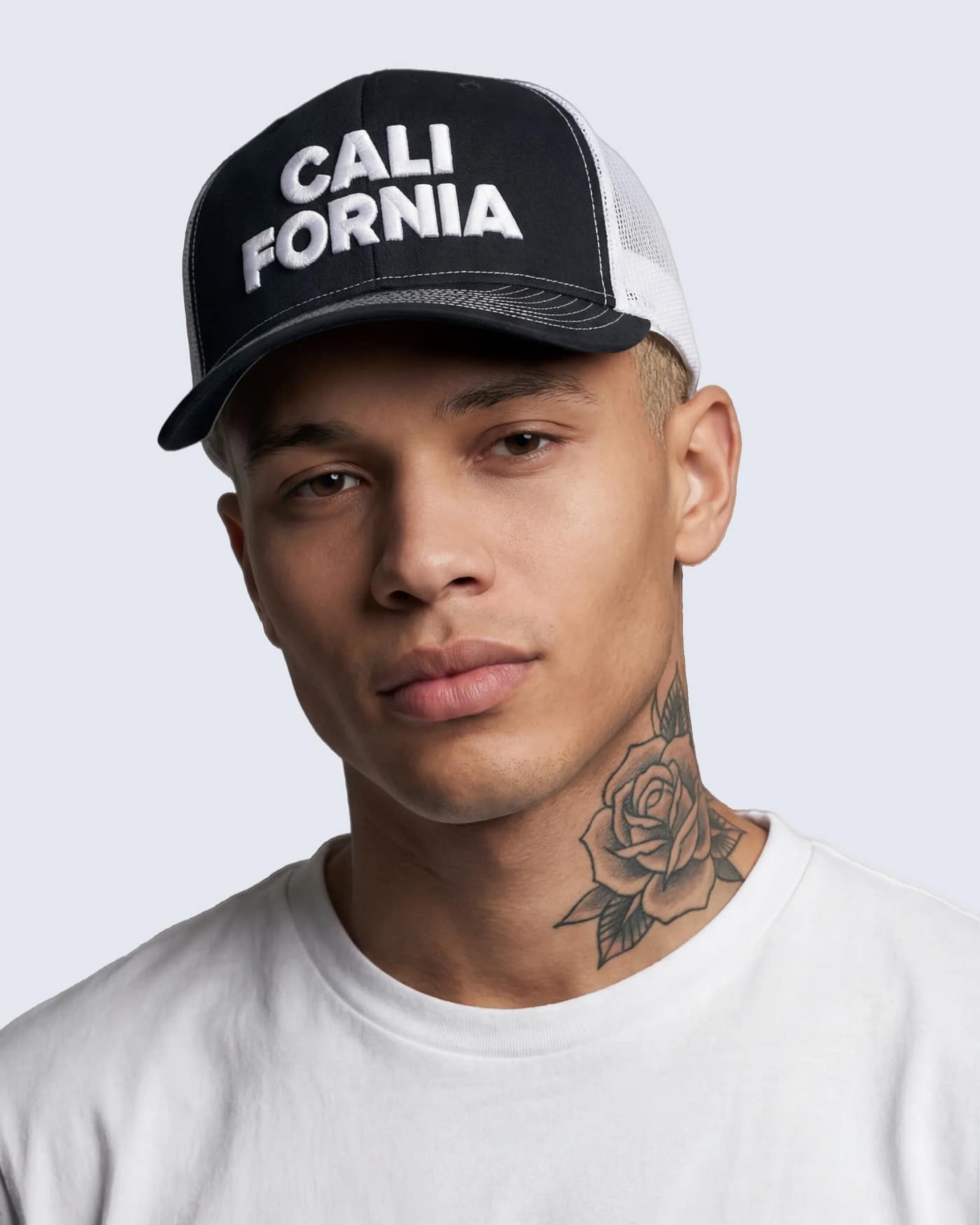 Black and white Trucker Hat with bold CALI 3-D puff embroidered graphic