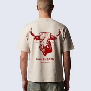 Back of FERN + FIN UNMANAGED t-shirt in light apricot with bull graphic