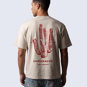 Back of FERN + FIN UNMANAGED t-shirt in light apricot with cactus graphic