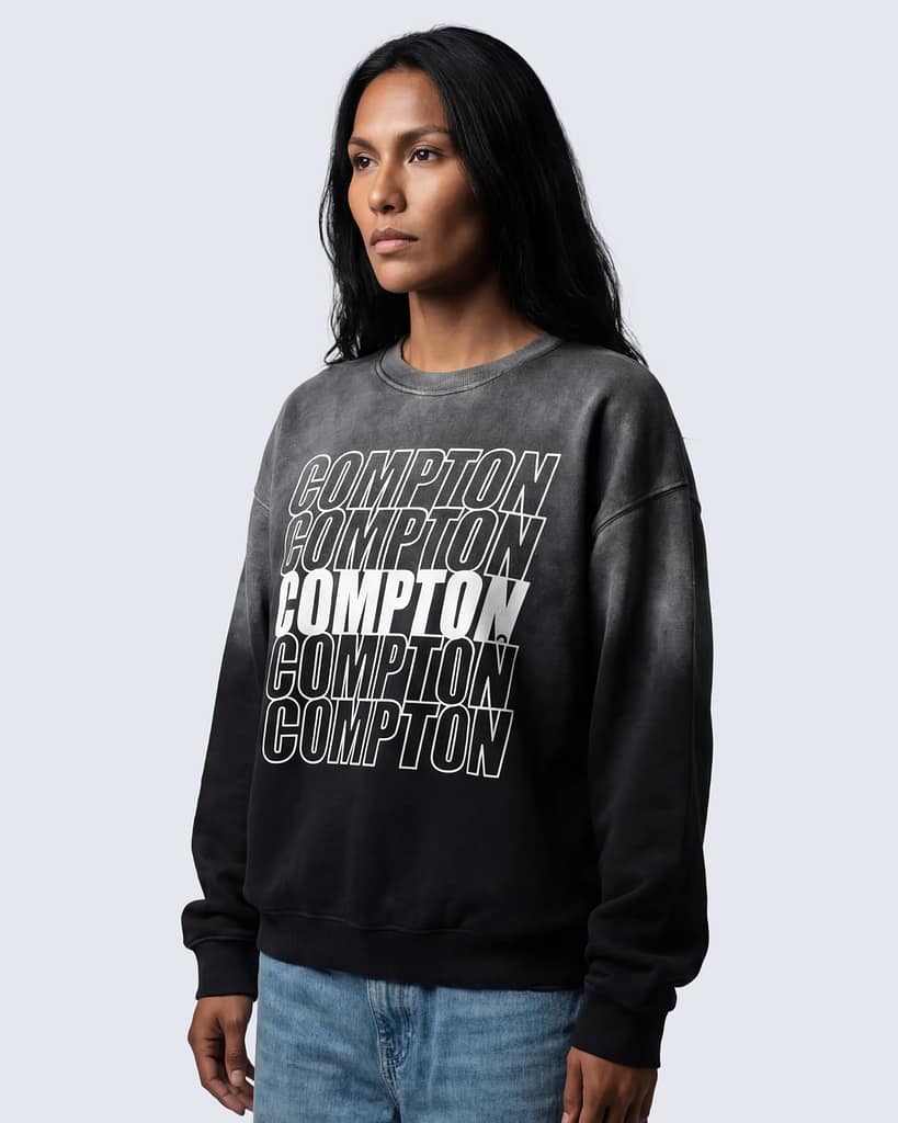 Charcoal sunfade sweatshirt with stacked “Compton” text design