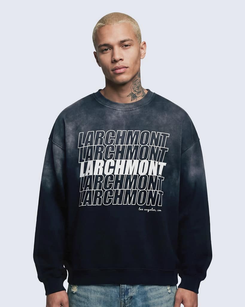 Dark sunfade sweatshirt with repeated “Larchmont” text design